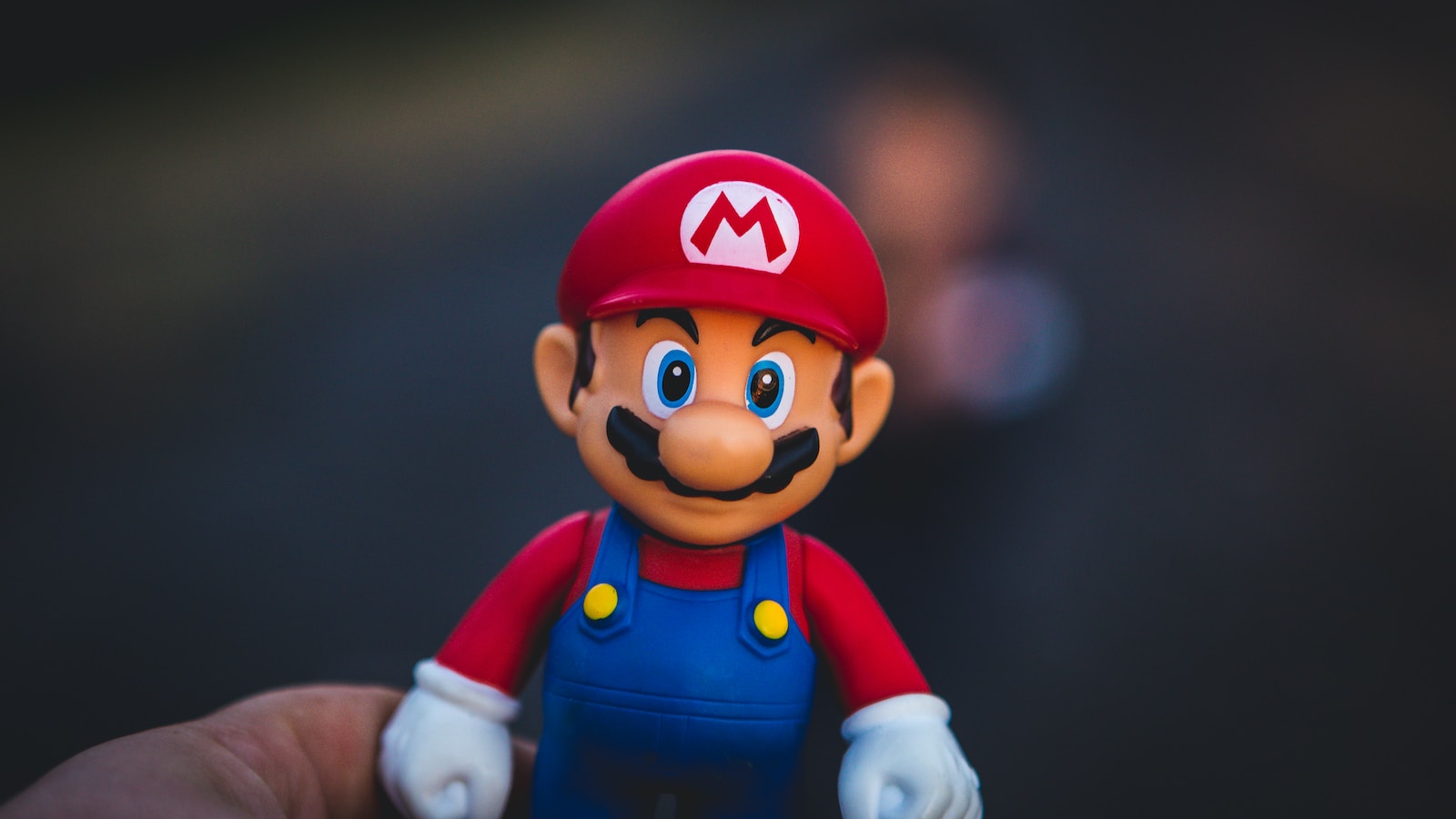 super mario in blue and red shirt figurine, the main character of Super Smash Bros Ultimate