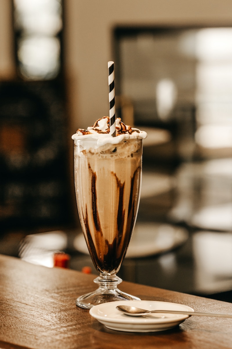 full-filled glass of a milkshake on a table